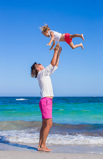 istock Father and little daughter have fun during tropical beach vacation 523001793