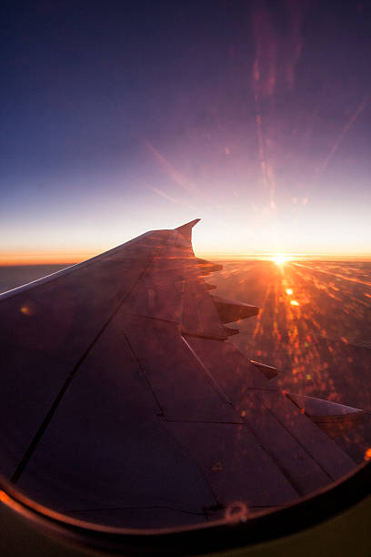 istock Aerial view of a cloudy sunset while flying above 523001803