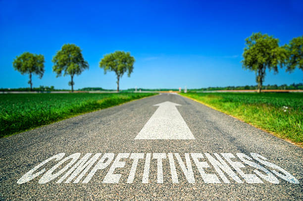istock Competitiveness word painted on asphalt road 523003249