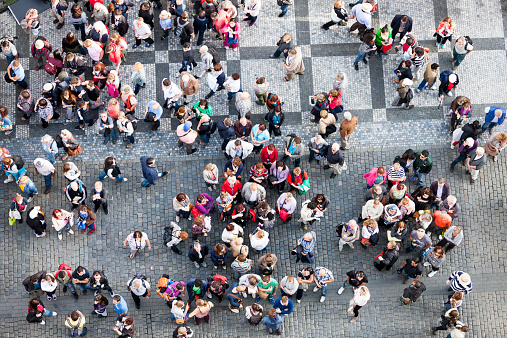 crowd of tourists and Prague residents in front of the Old Town City Hall, Old Town Square, Prague, Czech Republic