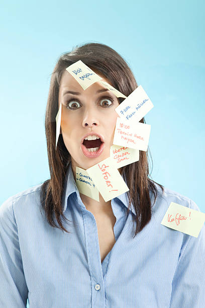 istock Businesswoman with adhesive notes on her face 523005719
