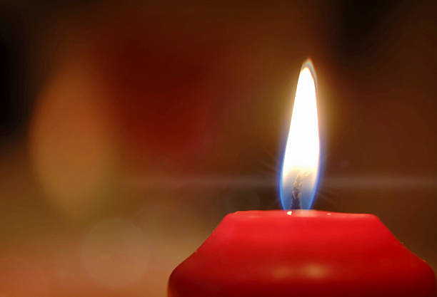 istock red burning candle Christmas 523006515
