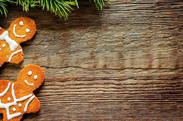 istock ginger biscuits and a branches of a Christmas tree 523006941