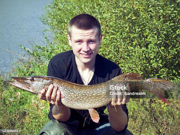 Man Holding A Pike In His Hands Stock Photo - Download Image Now - Catching, Child, Cold Drink