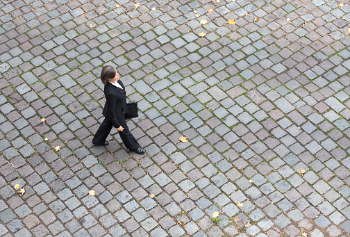 bird's-eye view of a businesswoman walking on the streets