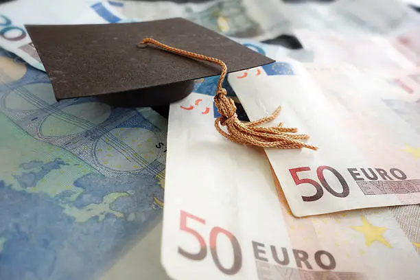 Graduation mortar board on Euro notes