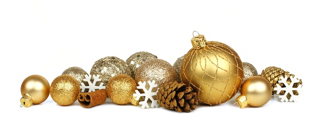Golden Christmas border of ornaments and snowflakes over a white background