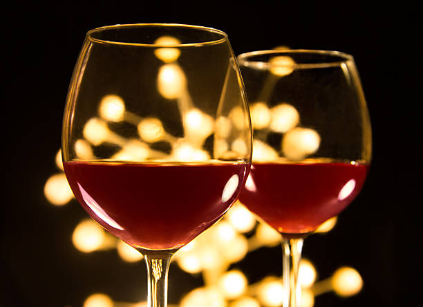 Two Red wine glasses. Christmas or romantic dinner.