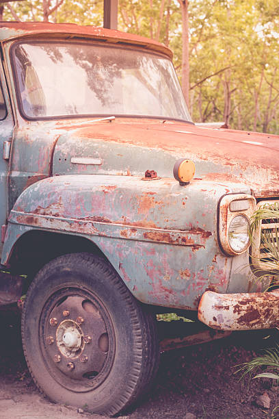 istock Abandoned Car - Old rusty car in forest. Vintage style. 523030064