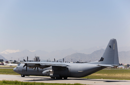 U.S. Airforce  C-130 Hercules Military cargo aircraft is on taxi way