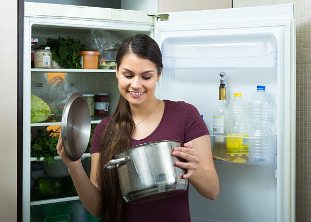 istock Girl near refrigerator at home 523032128