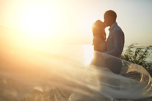 wedding photosession on the beach wedding photosession on the beach honeymoon photos stock pictures, royalty-free photos & images
