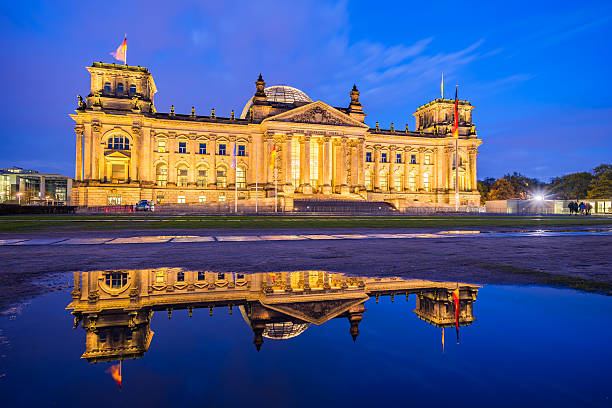istock The Reichstag building at night in Berlin, Germany 523033348
