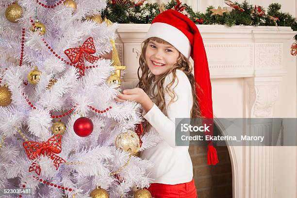 Christmas Girl Red Cap And Pants Stock Photo - Download Image Now - Adult, Awe, Beautiful People