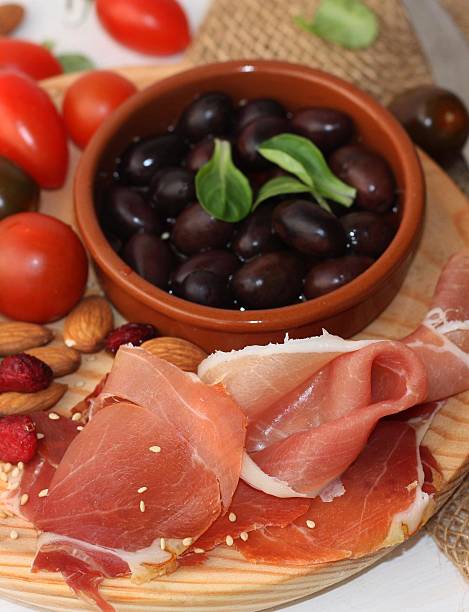 istock Ham with  olive oil on the wooden  board. 523037938