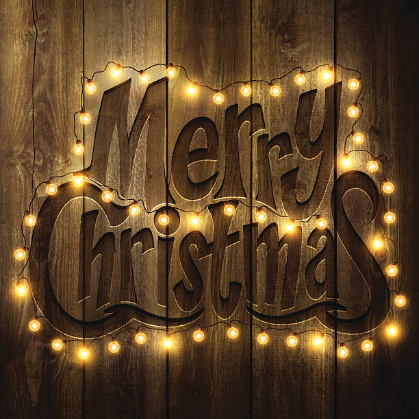 istock Merry Christmas Background with Christmas lights on wooden Wall 523038069