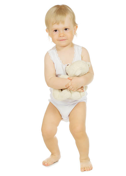 istock Little baby with teddy bear 523038490