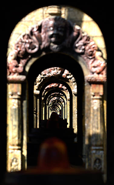 Shiva temple in Pashupatinath, Kathmandu, Nepal Ancient stone Hindu temple tunnel. Pashupatinath, Nepal lingam yoni stock pictures, royalty-free photos & images