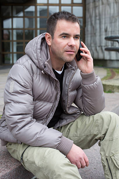 istock man outside on the phone 523038889