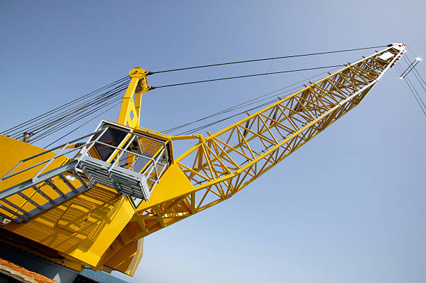 tower crane in der baustelle - industrial ship earth mover barge yellow stock-fotos und bilder