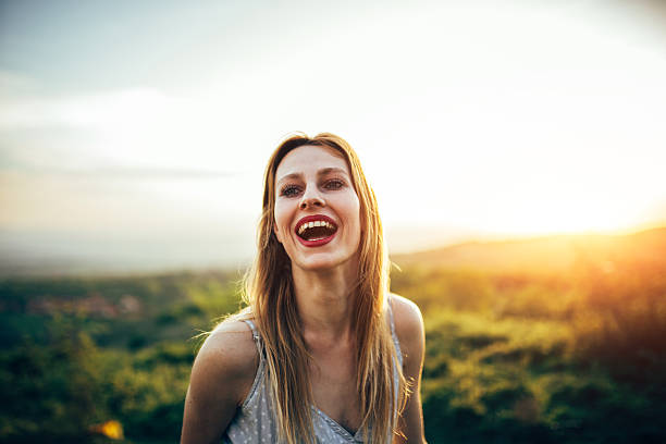 istock Girl smiling in sunset 523044792