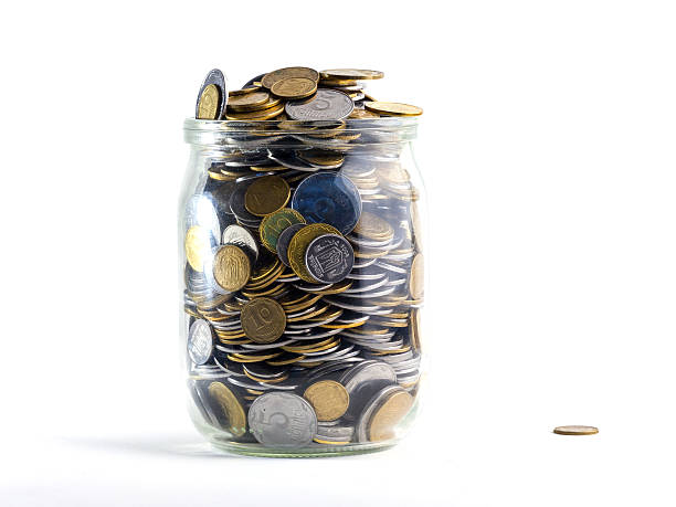 istock Jar of Money Isolated on a White Background 523048532