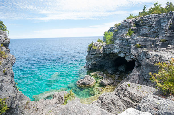 istock Blue water Rocky grotto beach 523050130