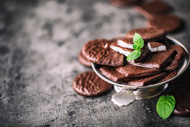 Chocolate peppermint cookies.Mint. Peppermint. Menthol. Black chocolate with peppermint cream. Black chocolate with mint stuffing. Menthol chocolate with mint leaves. Toned images.Chocolate peppermint cookies.Mint. Peppermint. Menthol. Black chocolate with peppermint cream. Black chocolate with mint stuffing. Menthol chocolate with mint leaves. Toned images.