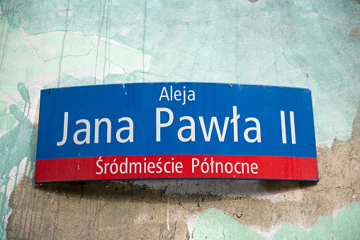 A sign for John Paul II Avenue in the Śródmieście Północne section of Warsaw, Poland