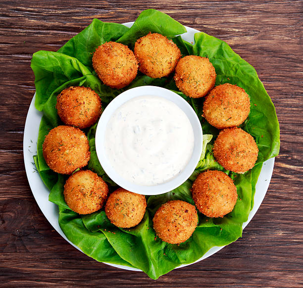 istock Fried mozzarella cheese stick balls with white sauce 523052486