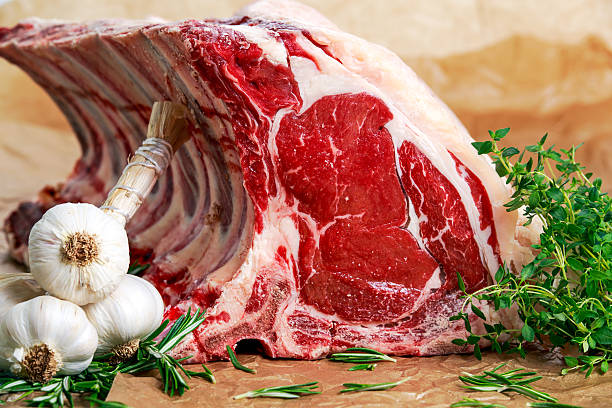 istock Fresh Raw Beef bone rib roughly choppid. with herbs. 523052688