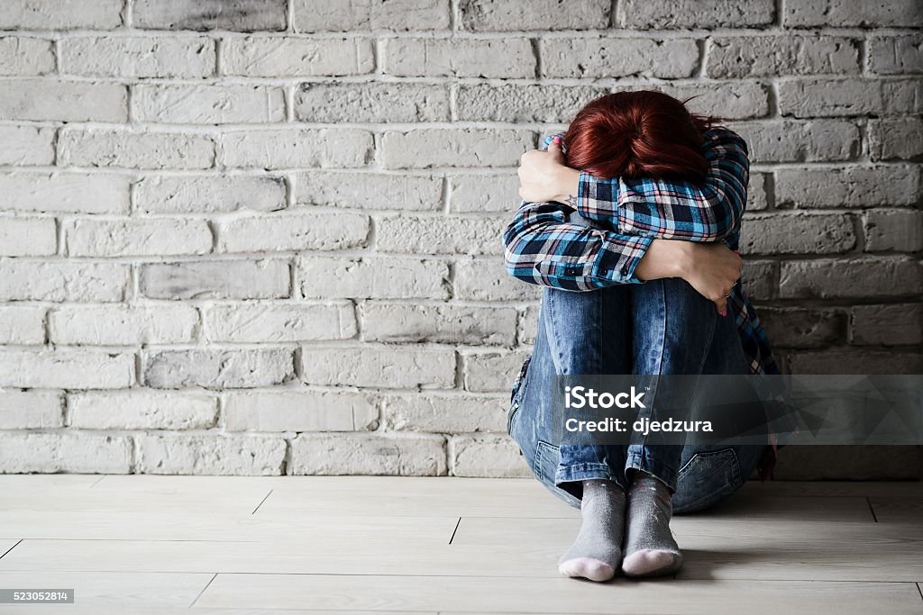 Depressed young crying woman - victim Depressed young crying woman - victim of domestic violence and abuse. Domestic violence Domestic Violence Stock Photo