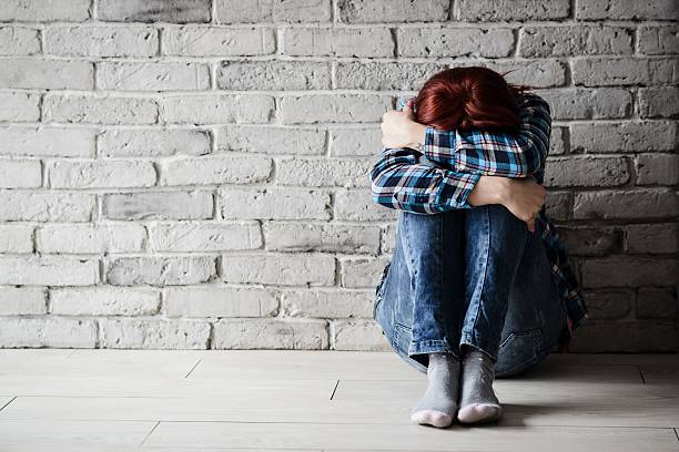 Depressed young crying woman - victim Depressed young crying woman - victim of domestic violence and abuse. Domestic violence torture photos stock pictures, royalty-free photos & images