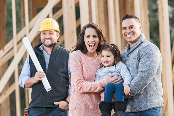 istock Hispanic family building a new home, with contractor 523053472