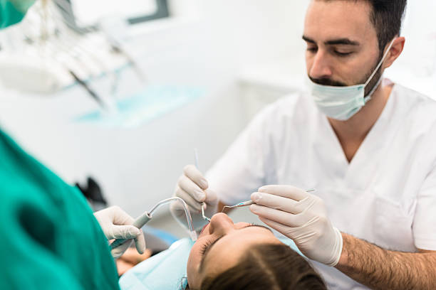 istock dentist doctor with the assistant in the clinic 523053792
