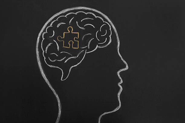 istock Puzzle piece drawn on blackboard in human head 523053896
