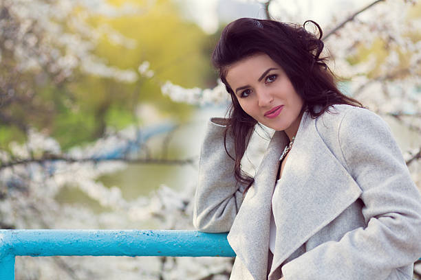 istock Beautiful woman and cherry blossom 523054934