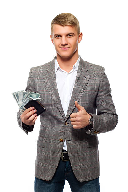 istock Young businessman holding money 523055038