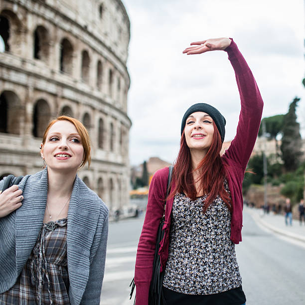 istock friends woman walking embraced in rome 523055992