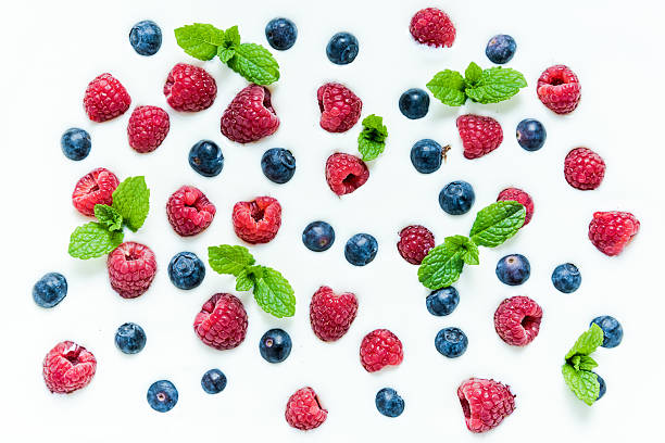 istock Food background, raspberries and blueberies on yoghurt 523056872