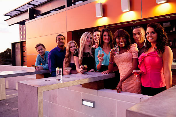 istock Group of young adults drinking outdoors 523057214