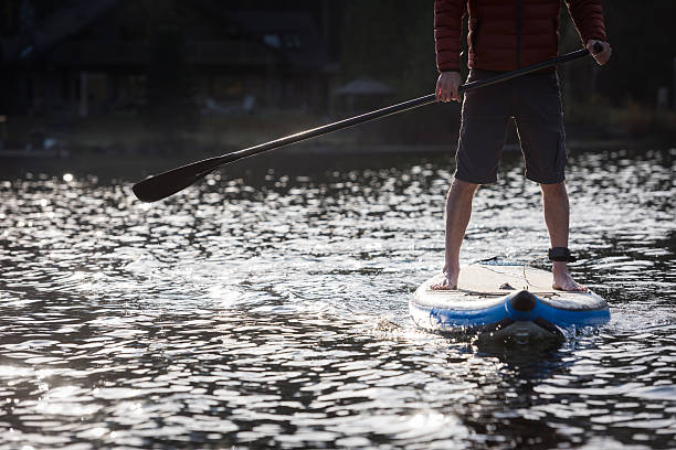 istock Stand up paddle boarding in the morning sun 523057554