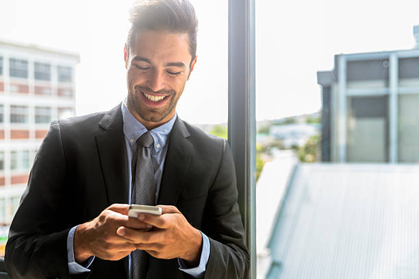 istock Happy businesswoman using smart phone at office 523058956