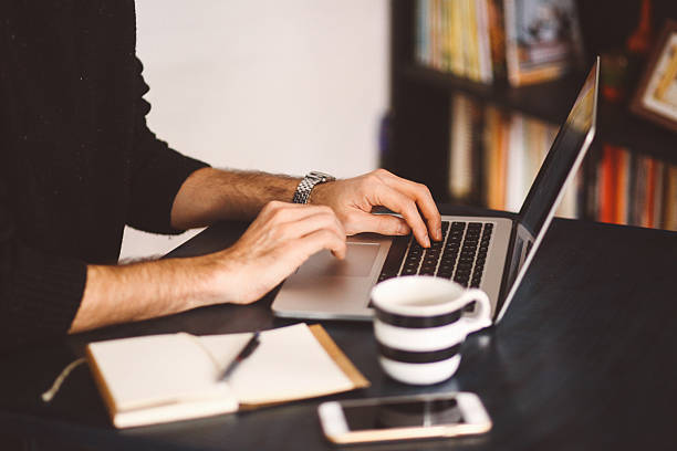 istock Young man typing at the laptop 523059438