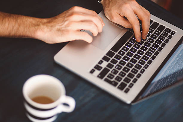 istock Young man typing at the laptop 523059662