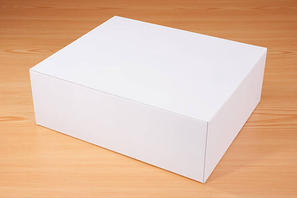 istock Blank white box mock up on wood background 523059830