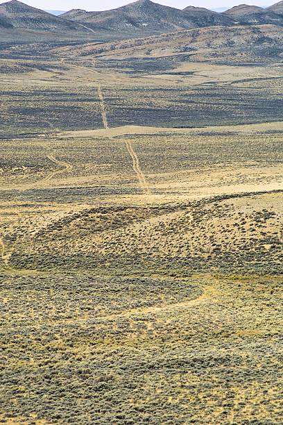 A longa Estrada no Deserto - fotografia de stock