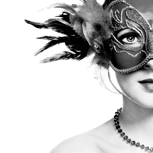 The beautiful young woman in mysterious venetian mask The beautiful young woman in mysterious venetian mask. Black and white photo carnival mask women party stock pictures, royalty-free photos & images