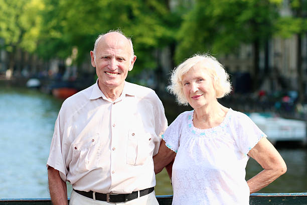 istock Happy senior couple sightseeing in Amsterdam 523092485