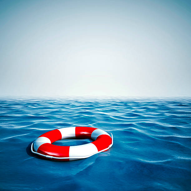 istock 3d life buoy and ocean with blue sky background 523094077